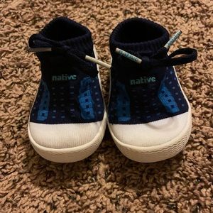 Native infant sock shoes size t3. Navy blue with light blue accents.